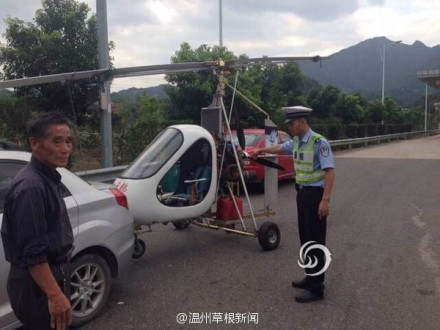 男子拖直升機(jī)上高速