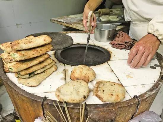 靠賣燒餅攢7套房